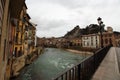 Main view of Ega river and old medieval buildings on its way through Estella village on a cloudy Easter afternoon, Navarra, Spain