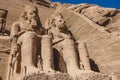 The main view of an Entrance to the Great Temple at Abu Simbel with Ancient Colossal statues of Ramesses II Royalty Free Stock Photo
