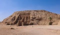 The main view of an Entrance to the Great Temple at Abu Simbel with Ancient Colossal statues of Ramesses II Royalty Free Stock Photo