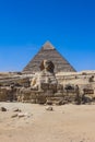 Main View to the Great Sphinx of Giza, is a giant limestone statue with the Great Pyramid in Background in Giza Royalty Free Stock Photo