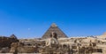 Main View to the Great Sphinx of Giza, is a giant limestone statue with the Great Pyramid in Background in Giza Royalty Free Stock Photo