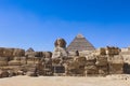 Main View to the Great Sphinx of Giza, is a giant limestone statue with the Great Pyramid in Background in Giza Royalty Free Stock Photo