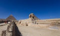 Main View to the Great Sphinx of Giza with the Great Pyramid in Background in Giza, Egypt Royalty Free Stock Photo