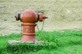 Main water valve on green grass Royalty Free Stock Photo