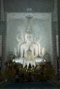 A main white Buddha sits in the Buddhism thai Church. At Wat Huay Pla Kang temple.