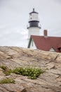 Maine lighthouse Portland Head Light and rocky cliff Royalty Free Stock Photo