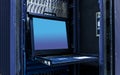 The mainframe server screen and communication racks in data center for large organization Royalty Free Stock Photo