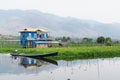 Maing Thauk, Myanmar - April 2019: traditional Burmese floating house on water in Inle lake Royalty Free Stock Photo