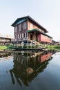 Maing Thauk, Myanmar - April 2019: traditional Burmese floating house on water in Inle lake