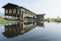 Maing Thauk, Myanmar - April 2019: traditional Burmese floating house on water in Inle lake Royalty Free Stock Photo