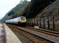 Mainline train leaving Teignmouth station heading towards Exeter Royalty Free Stock Photo