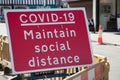 A Maintain Social Distance sign for Covid 19 in Stratford upon Avon in Warwickshire in the UK