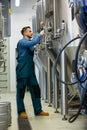 Maintained worker working at brewery Royalty Free Stock Photo