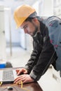 Maintenance engineer inspect relay protection system with laptop Royalty Free Stock Photo