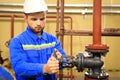 Maintenance engineer  turns a main valve and launch technological process Royalty Free Stock Photo