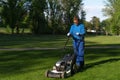 The worker mows the lown, maintenance of greenery image