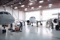 maintenance hangar, with team of technicians performing routine checkups on aircraft Royalty Free Stock Photo