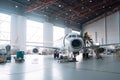 maintenance hangar, with team of technicians performing routine checkups on aircraft Royalty Free Stock Photo
