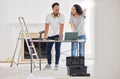 Maintenance, laptop and diy with a couple in their new house together for a remodeling project. Construction, real Royalty Free Stock Photo