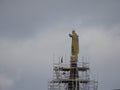 Maintenance, restoration of old Jesus statue, scaffolding on church Royalty Free Stock Photo