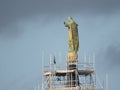 Maintenance, restoration of old Jesus statue, scaffolding on church Royalty Free Stock Photo