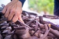 The maintenance technician is checking the condition of the engine to be ready for use. In the car service center Royalty Free Stock Photo