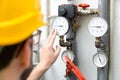 Maintenance - technician checking heating pressure meters