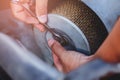 The maintenance technician is using a wrench to remove the air filter for cleaning,Concept repair the car. Instagram style filter Royalty Free Stock Photo