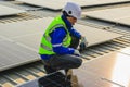 Maintenance technicians installing solar panels at solar cell farm Royalty Free Stock Photo