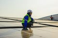 Maintenance technicians installing solar panels at solar cell farm Royalty Free Stock Photo
