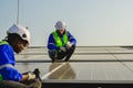 Maintenance technicians installing solar panels at solar cell farm Royalty Free Stock Photo
