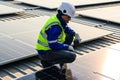 Maintenance technicians installing solar panels at solar cell farm Royalty Free Stock Photo