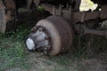 Maintenance a truck wheels hub and bearing. Dirty heavy truck drum brakes maintenance, old used brake drum with wheel pins. Rusty