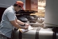 Maintenance and Vehicle safety inspection. Asian a truck driver inspecting fuel tank of semi truck.