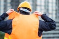 Maintenance worker man weraing reflective vest at site