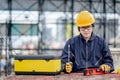 Maintenance worker preparing work tool at site Royalty Free Stock Photo