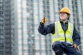 Maintenance worker showing thumb up on ladder Royalty Free Stock Photo