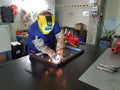 Maintenance worker welder, craftsman welding metal iron material, with flash light