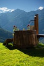 Wooden water fountain in the Italian Alps, Piemonte, Italy Royalty Free Stock Photo