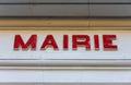 `Mairie` sign ie `Town hall` in French written in red, over the door of a french town hall Royalty Free Stock Photo