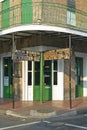 Maison Bourbon Jazz Club with Green Doors in morning light of French Quarter in New Orleans, Louisiana