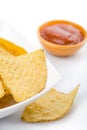 Maize chips in white bowl and salsa sauce