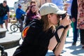 Maja KSIEZOPOLSKA, professional photographer covering an evangelist demonstration in the street of Warsaw, Poland - May 28, 2023