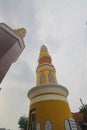 Majalengka Grand Mosque tower (Masjid Agung Al-Imam Majalengka) rises high against the grey sky on a cloudy day