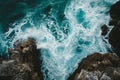 Majestic Aerial View of Ocean Waves Crashing on Rocky Coastline, Elevated view of ocean waves splashing against a rocky shoreline Royalty Free Stock Photo