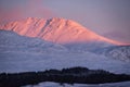 Majestic Alpen Glow hitting mountain peaks in Scottish Highlands during stunning Winter landscape sunrise Royalty Free Stock Photo