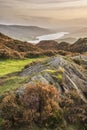 Majestic Autumn sunset landscape image from Holme Fell looking towards Coniston Water in Lake District Royalty Free Stock Photo