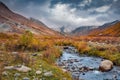 Majestic autumn view of Patara Enguri river anf Shkhara peak on background.