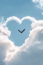 Majestic Bird Soars Through Heart Shaped Clouds in Blue Sky Royalty Free Stock Photo