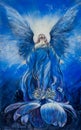 Majestic blue angel of love looks up in the radiance to the divine sky